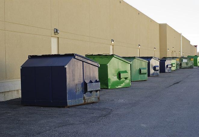 a pack of different construction bins lined up for service in Adger, AL